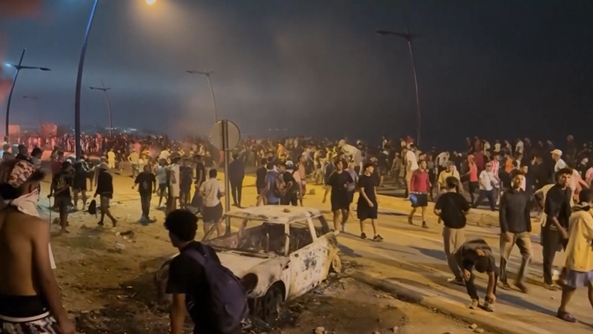 Security forces and migrants in Ceuta, Spain