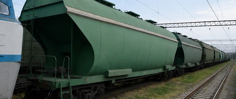Freight train carrying cargo along railway tracks